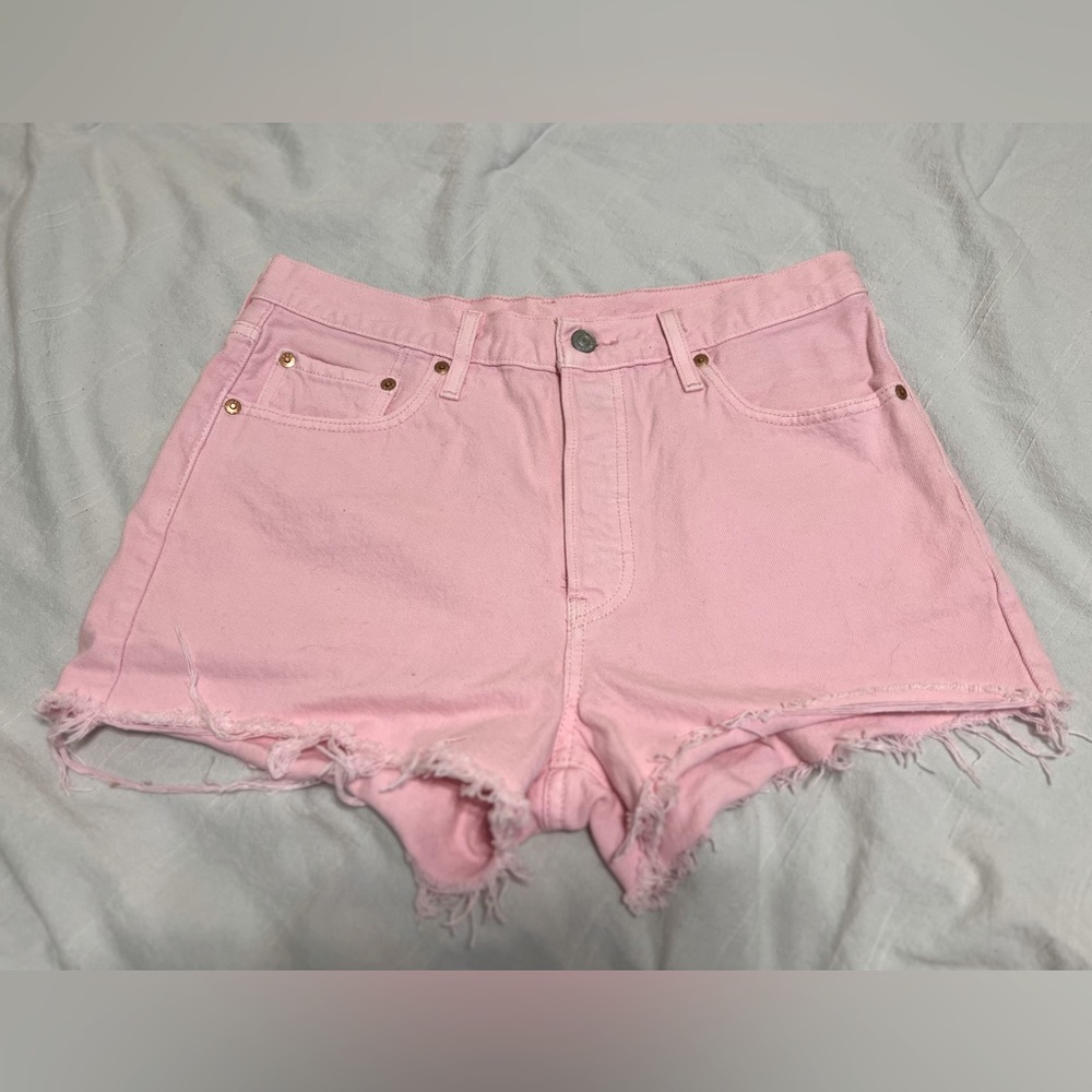 Levi’s. Womens. Distressed pink denim shorts. Size 29.